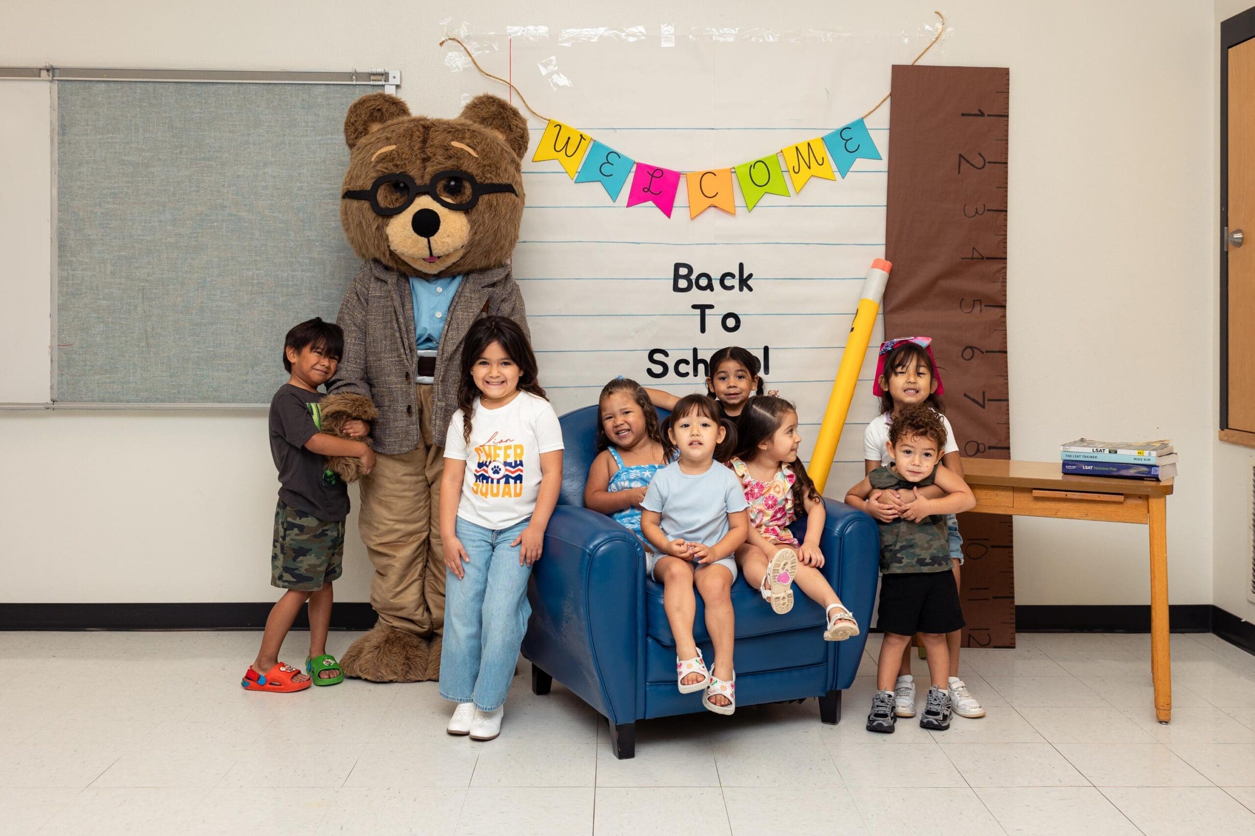 2026 Back-to-School Bash & Shoe Drive 13 | Christian's Manor Christian’s Manor children with the mascot at the 2026 Back-to-School Bash photo booth
